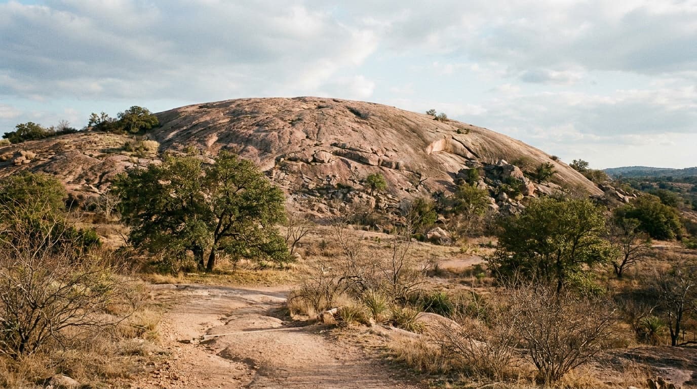 The pink granite dome of Enchanted Rock rising above the Texas Hill Country