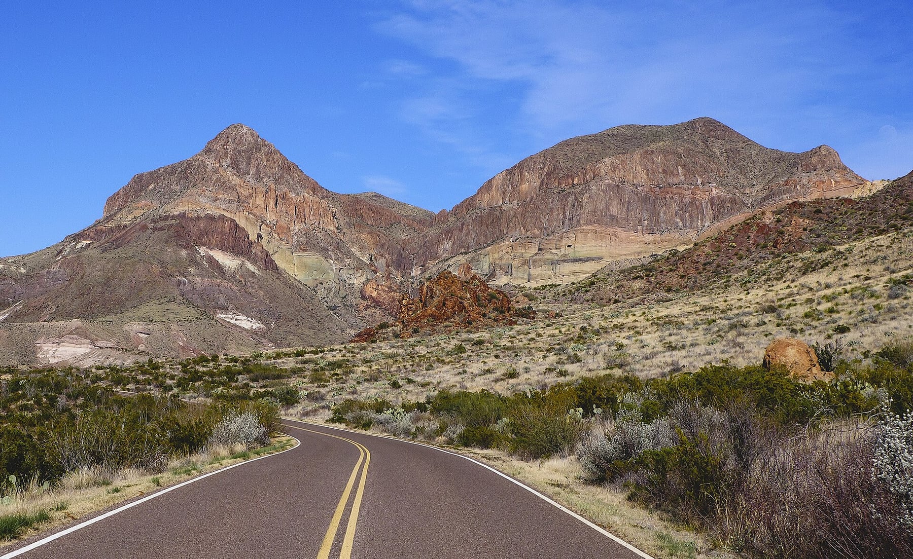 Ross Maxwell Scenic Drive crossing open desert below rugged hills