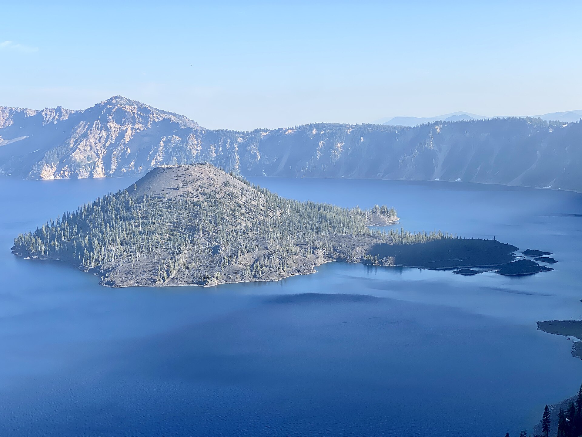 Wizard Island rising from Crater Lake's deep blue water