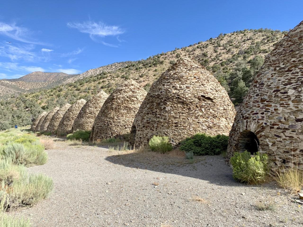 Historic stone charcoal kilns standing in a row