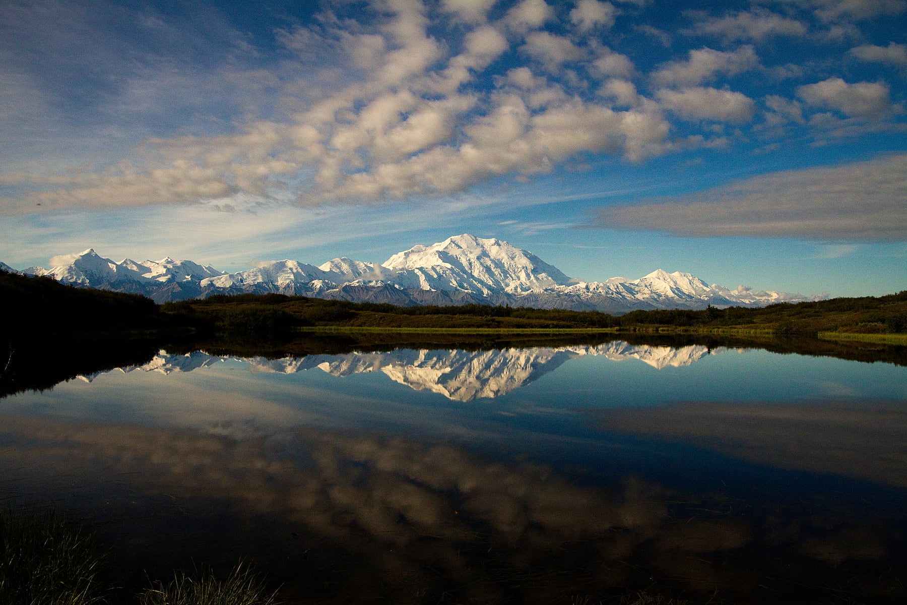Snowy mountains reflected in a Denali pond