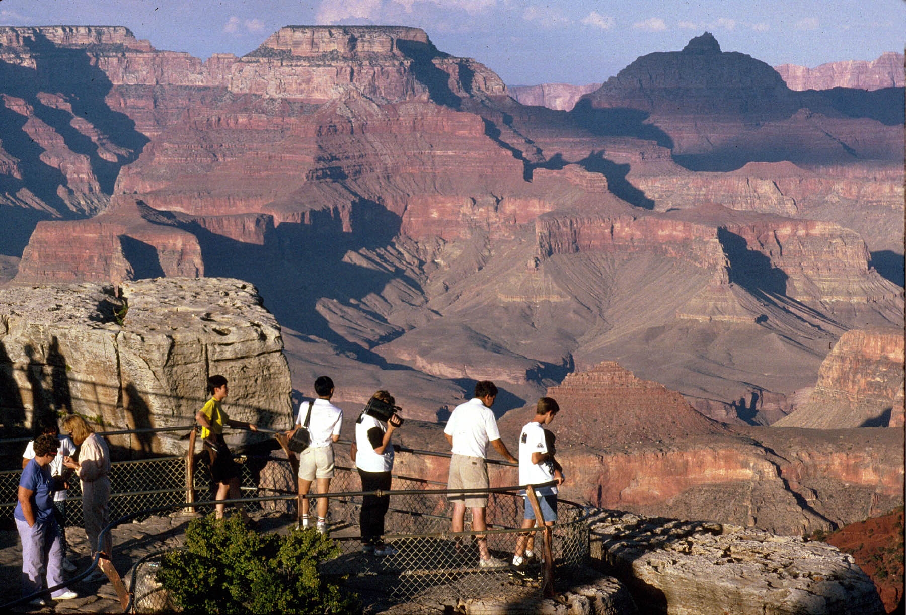 Visitors looking into Grand Canyon from Mather Point on the South Rim