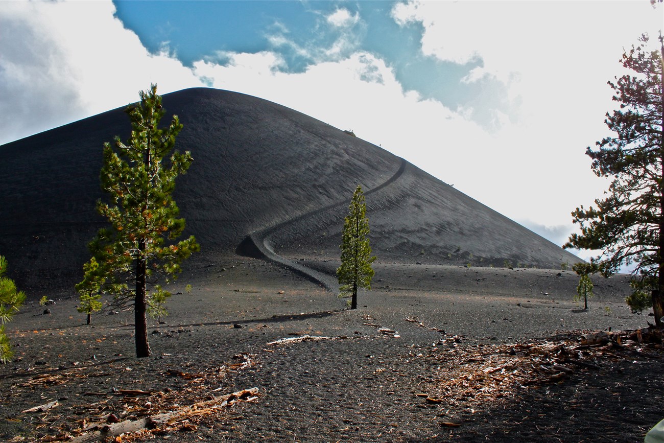Cinder Cone rising above volcanic terrain
