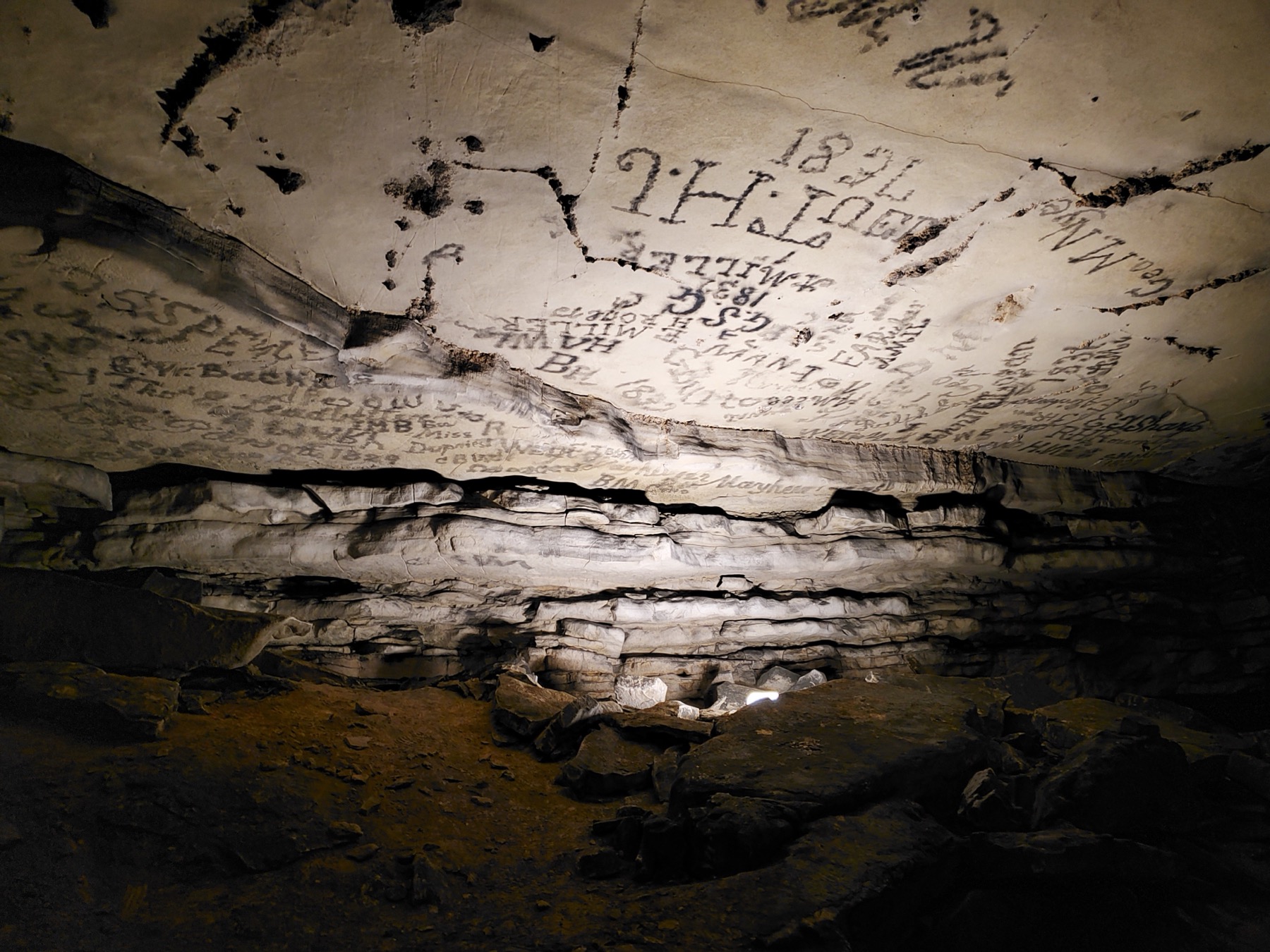 Historic signatures written on a Mammoth Cave passage wall