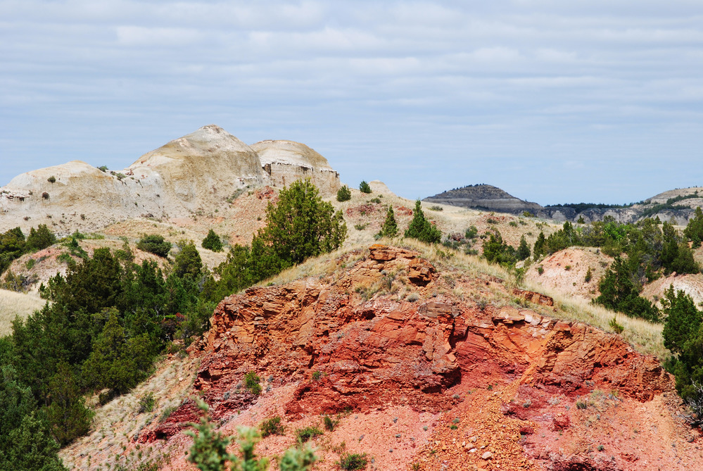Layered red badlands in Theodore Roosevelt National Park