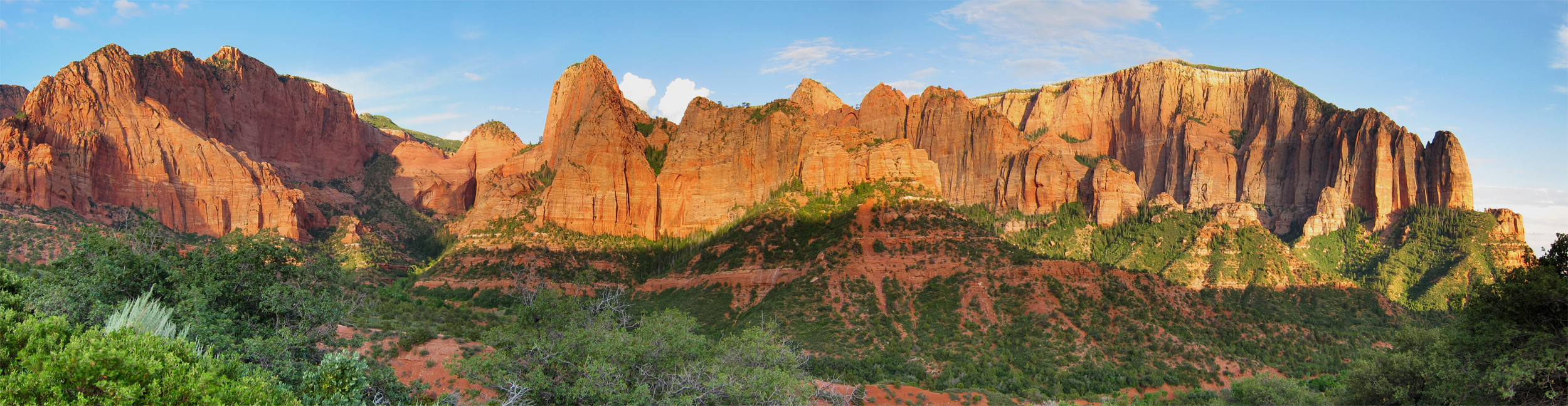 A wide red-rock panorama of the Kolob Canyons section of Zion